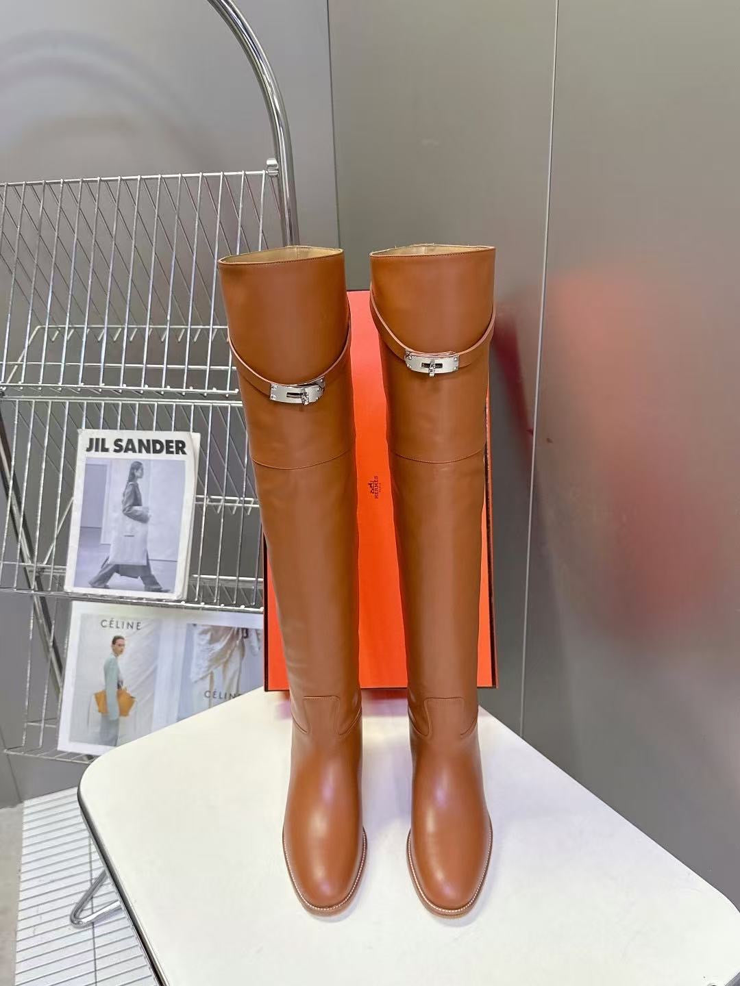 Red leather over-the-knee boots with silver lock buckle